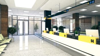 Modern office reception area with check-in desks, chairs, and glass walls in a bright lobby