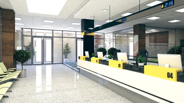 Modern financial facility lobby with reception desks, seating, and polished floors